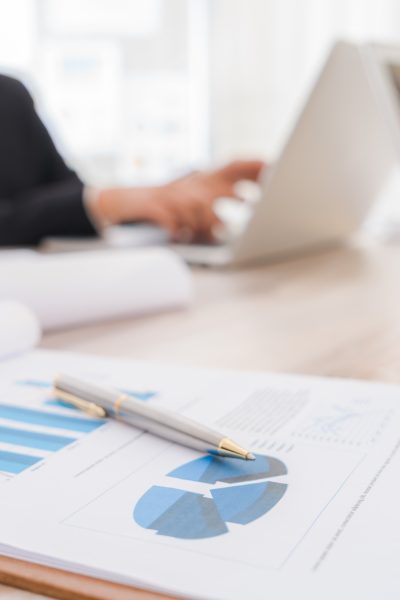 Business people using laptop  and Financial charts  at meeting office